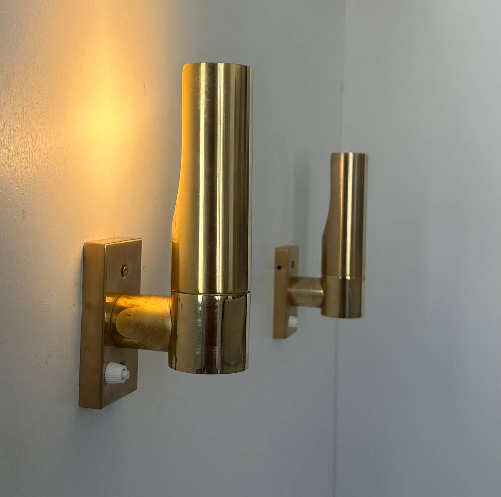 Pair of vintage adjustable brass wall lights, France 1970.
