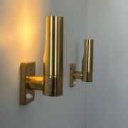 Pair of vintage adjustable brass wall lights, France 1970.
