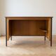 Vintage style desk by Jean Prouvé in oak and black metal.