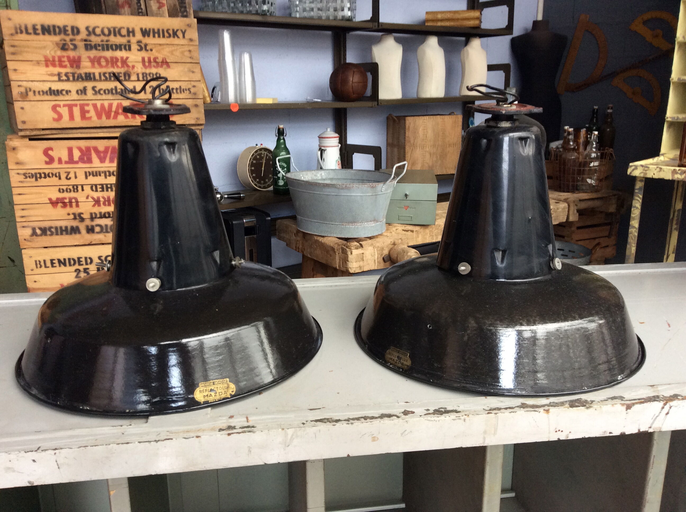 Hanging reflectolux mazda in black enamelled sheet metal.