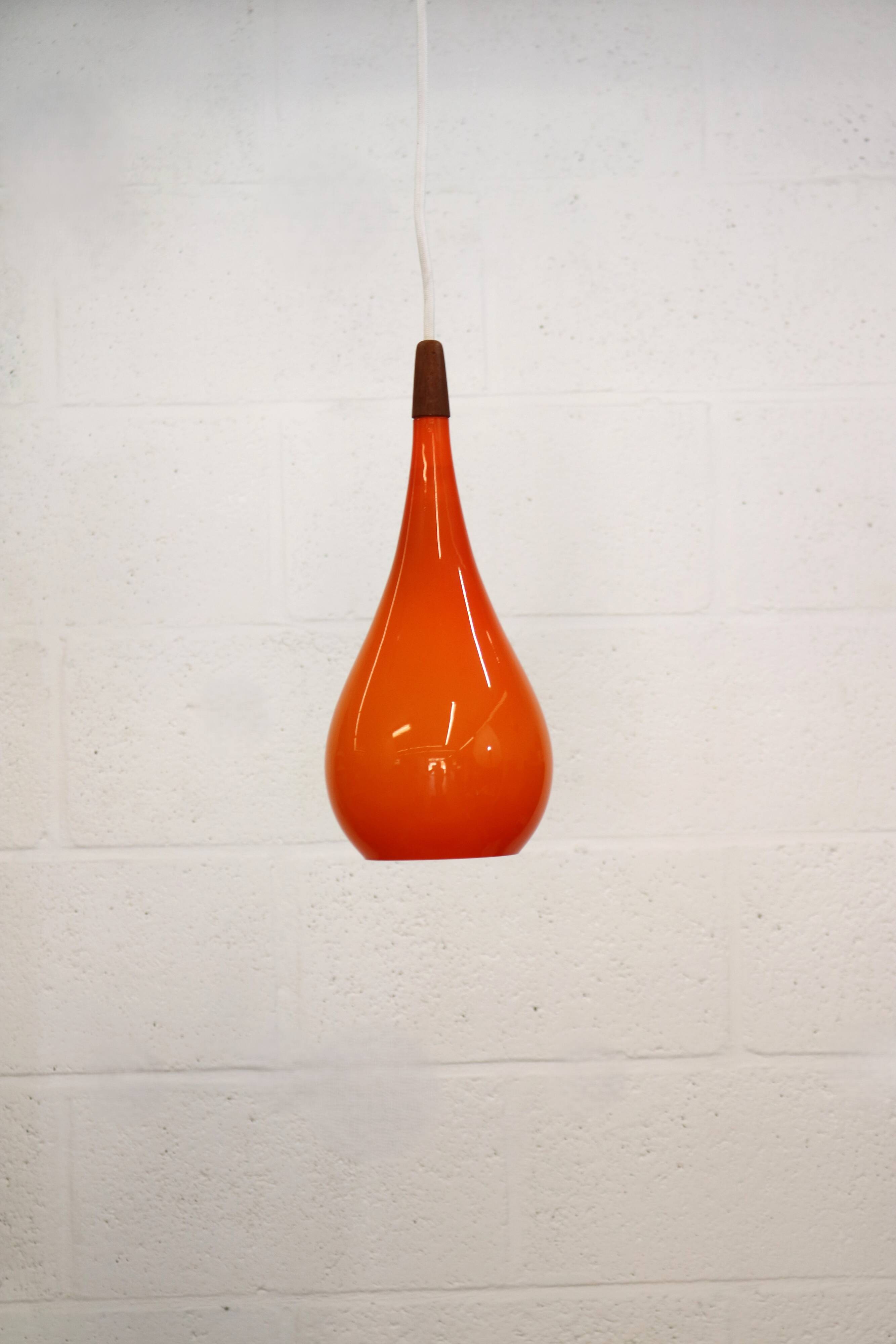 Orange teardrop glass pendant lamp made by Holmegaard - Denmark 1960