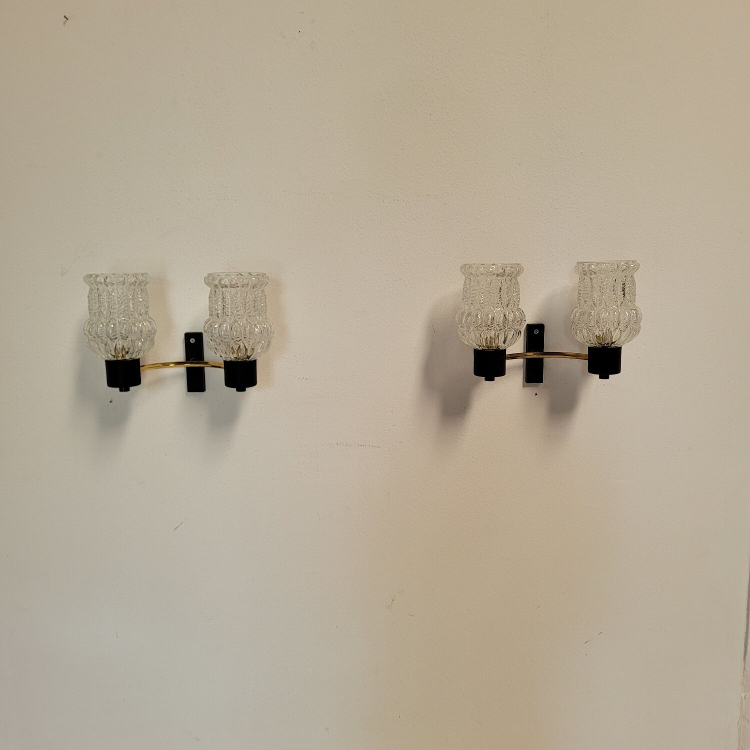 Vintage Arlus wall lights in glass and brass from the 1970s.