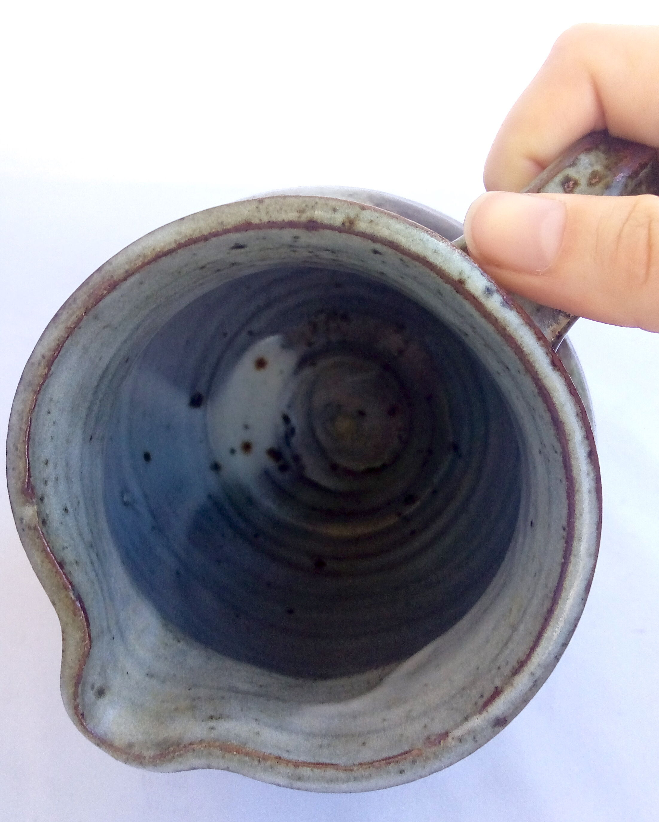 Sarthois pitcher in grey sandstone and rust effect