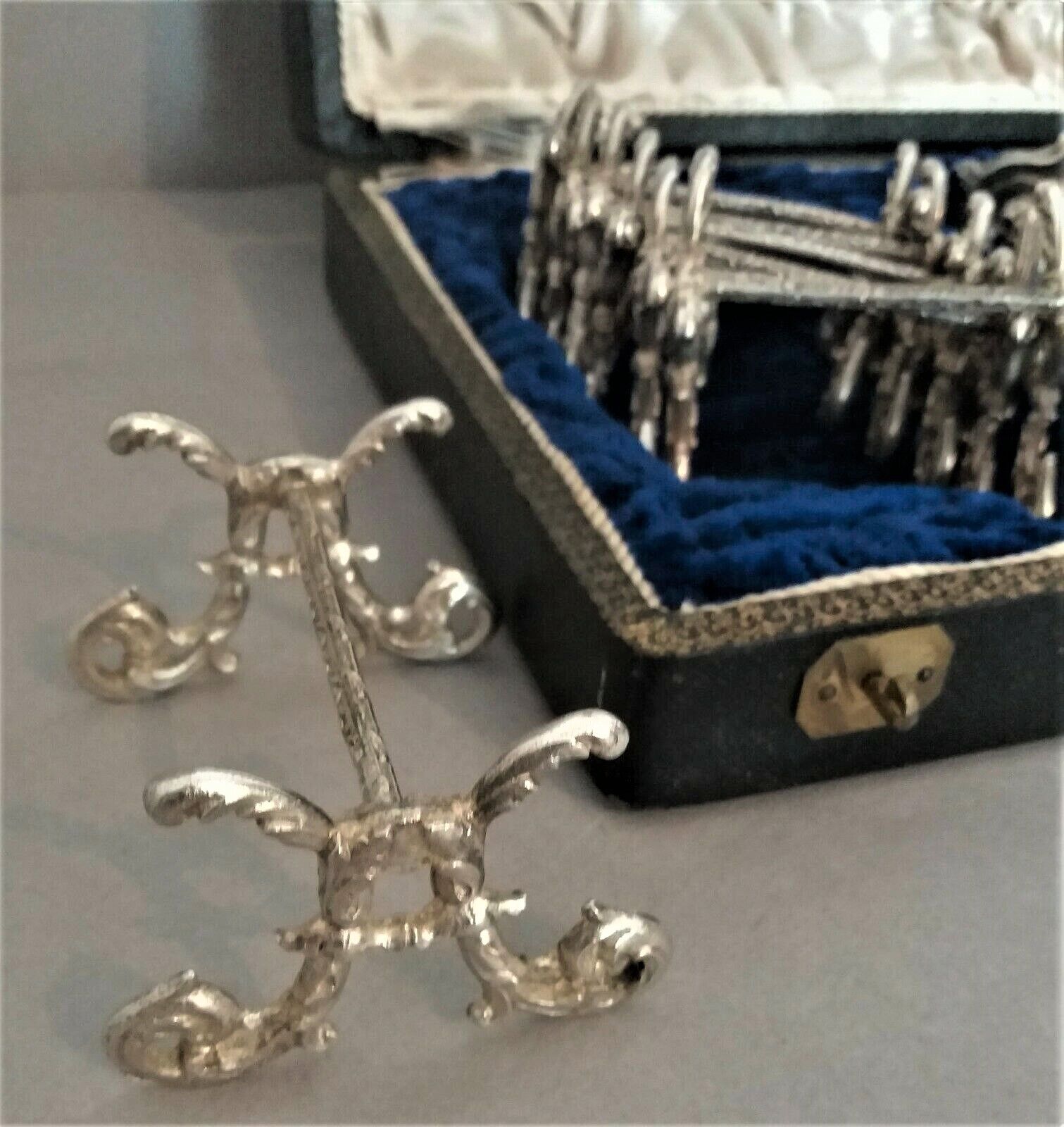 Twelve knife holders with ladle doors.