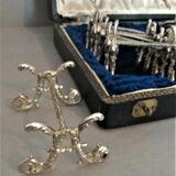 Twelve knife holders with ladle doors.