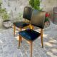 Two vintage Scandinavian chairs in beech and black leatherette