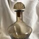 Art Deco smoked glass carafe with fan-shaped stopper.