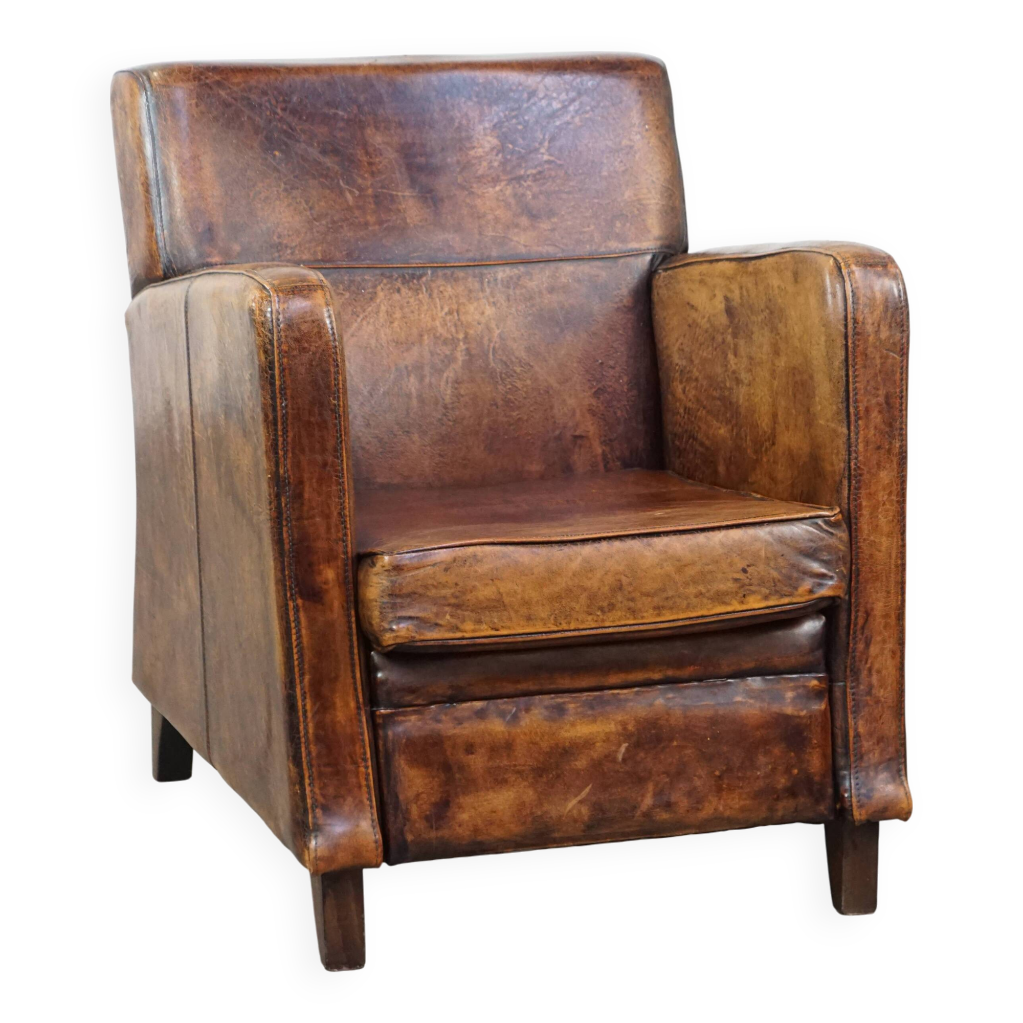 Dark brown design armchair made of sheepskin leather