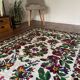 White vintage floral rug made by hand in Romania, beautiful flowers