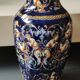 Twisted design vase. Signed Gien France/Renaissance blue background 26 x 13cm
