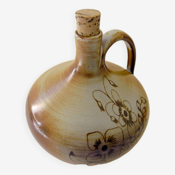 Glazed terracotta brandy bottle with plant decoration