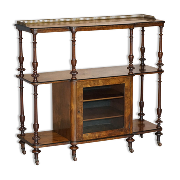 Fine walnut burl bookshelf with brass railing and wheels.