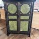 Small Chinese cabinet in black lacquer.