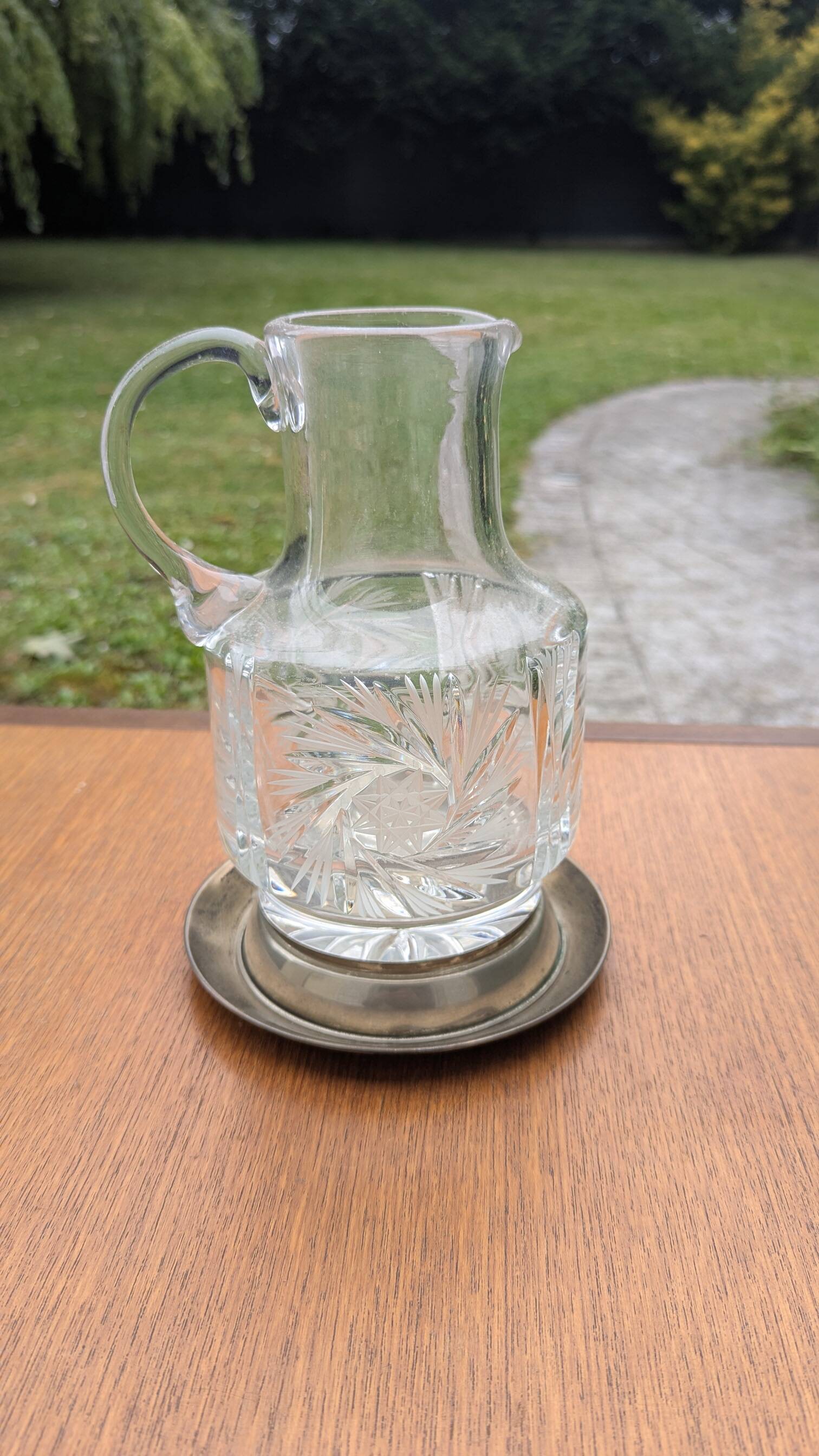 Jug / Carafe made of cut glass or crystal with its metal under-bottle.