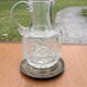 Jug / Carafe made of cut glass or crystal with its metal under-bottle.