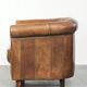Sheepskin clubarmchair with beautiful patina finished with decorative nails