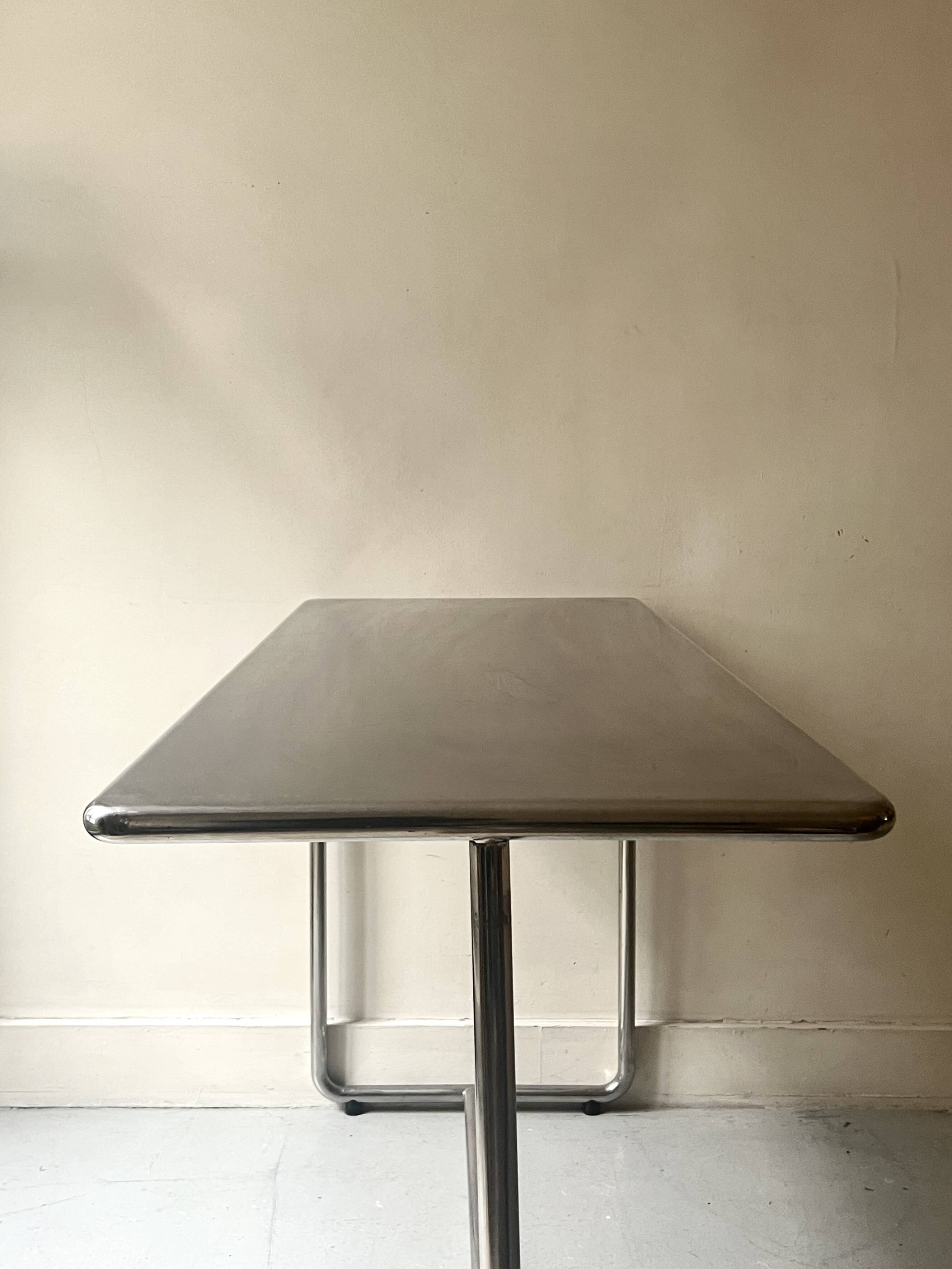 Dining table / tubular and modernist desk in chrome metal
