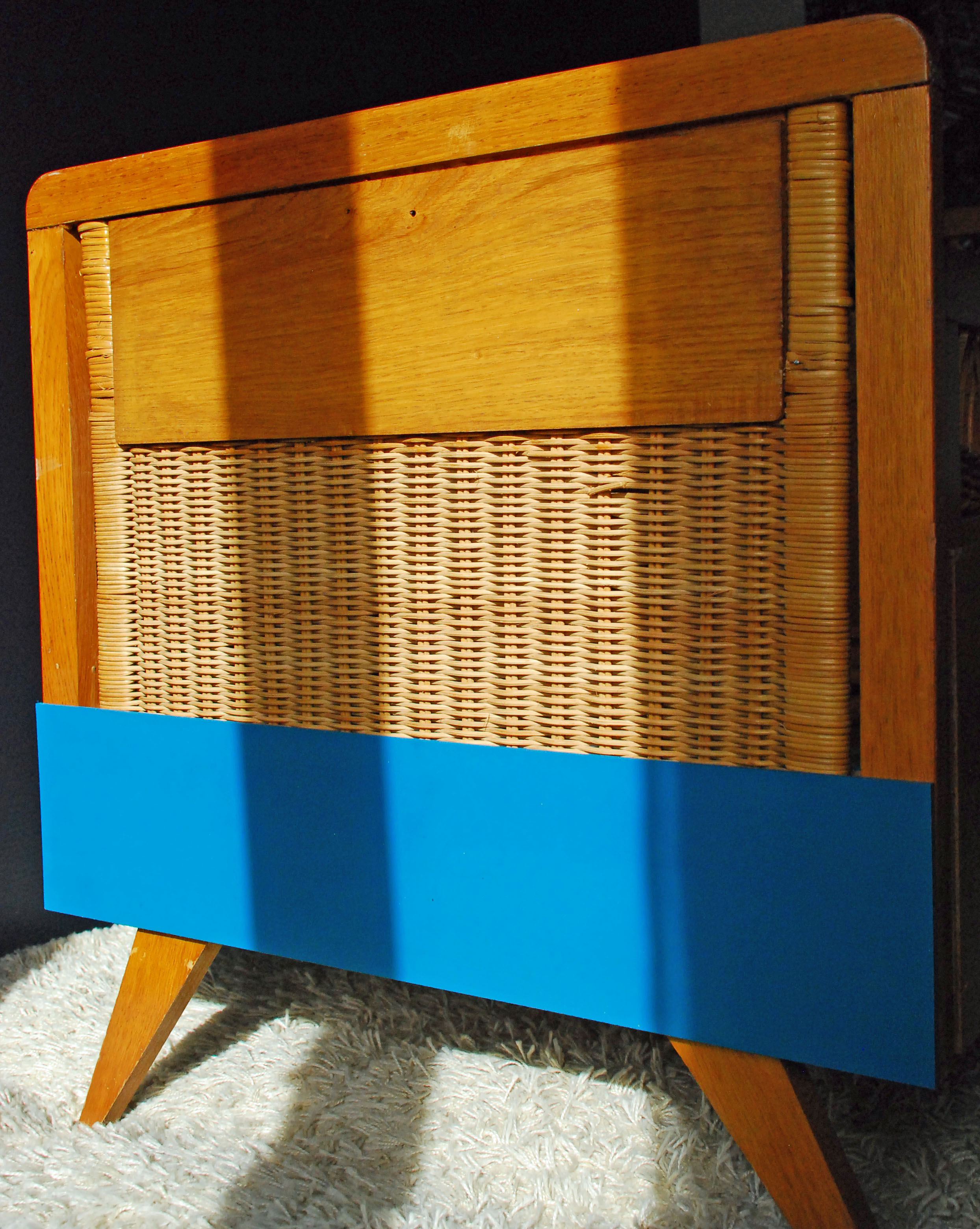 Wooden bed and vintage rattan
