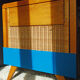 Wooden bed and vintage rattan