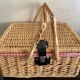 Large Suitcase, wicker picnic basket and red Vichy