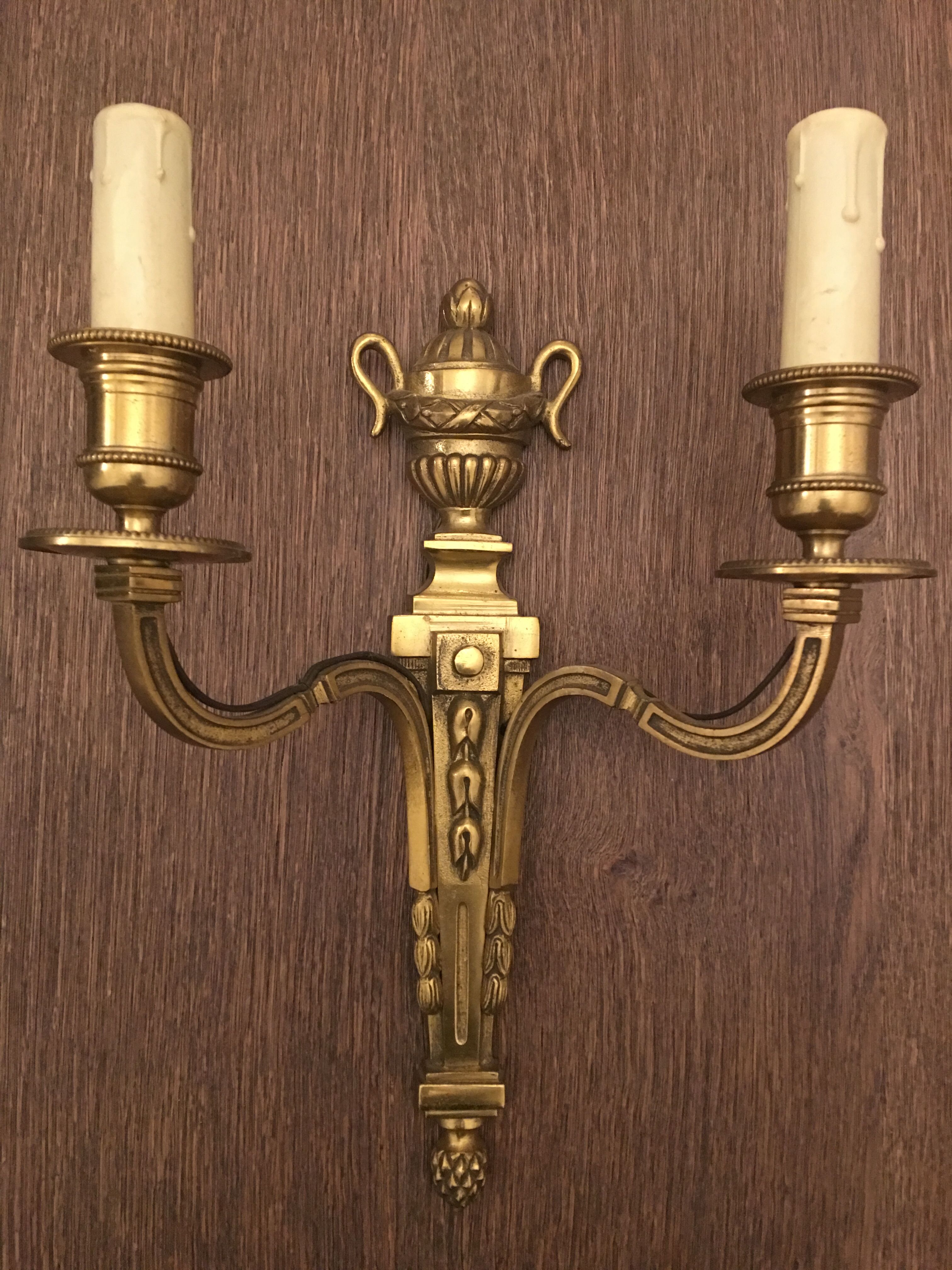 Eleven gilded bronze wall lamps