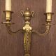 Eleven gilded bronze wall lamps