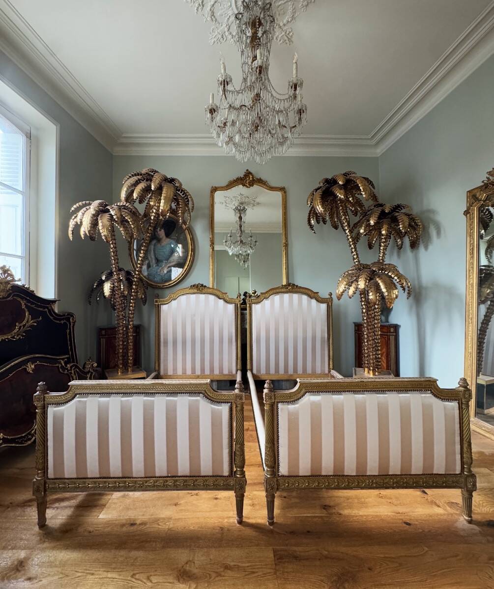 Pair of late 19th-century gilded wooden beds in Louis XVI style.