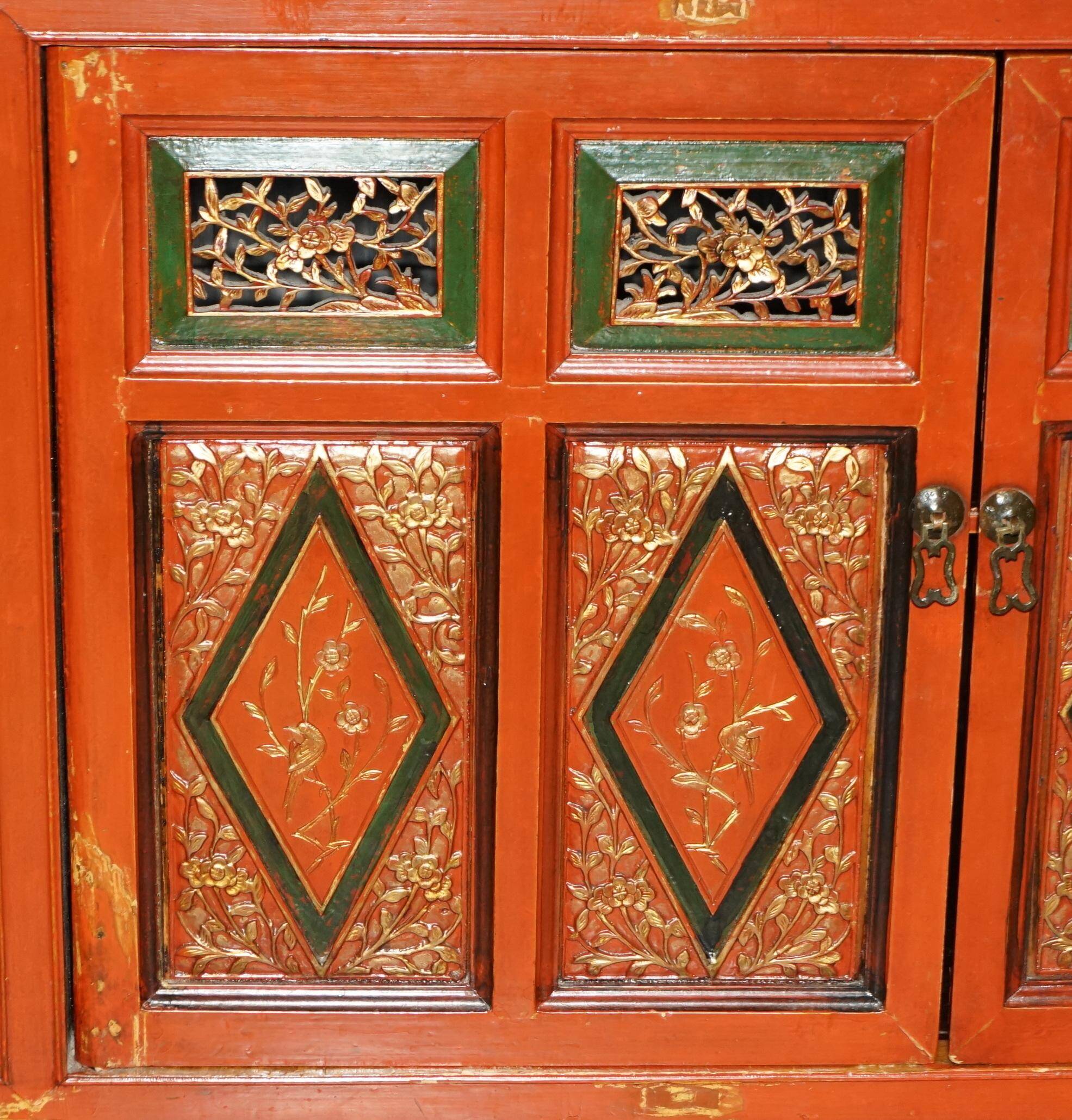 Vintage Chinese lacquered buffet decorated with gold leaf.