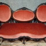 Very large Louis XV style mahogany banquette with medallions from the 19th century.
