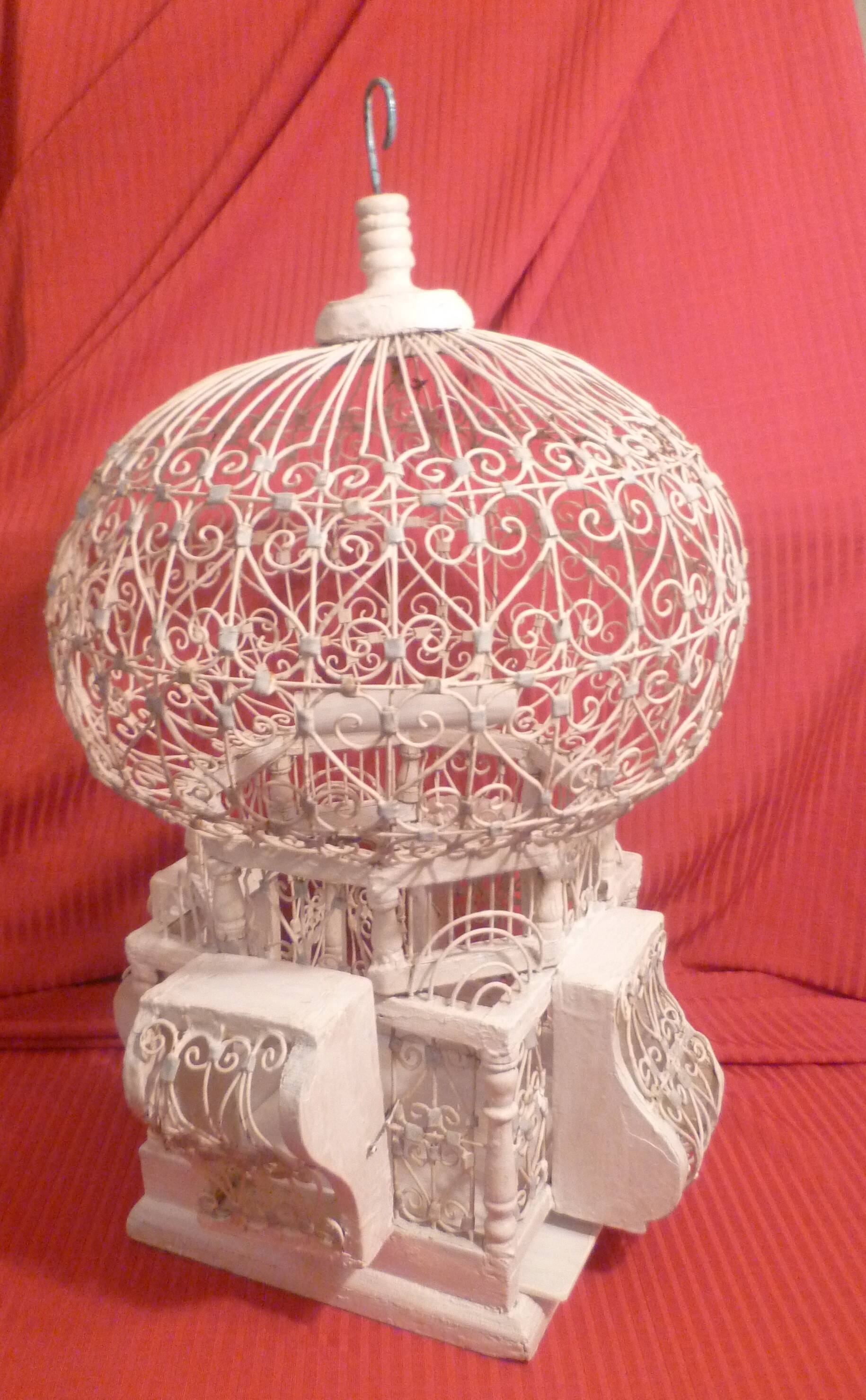 Antique handmade birdcage in metal and wood