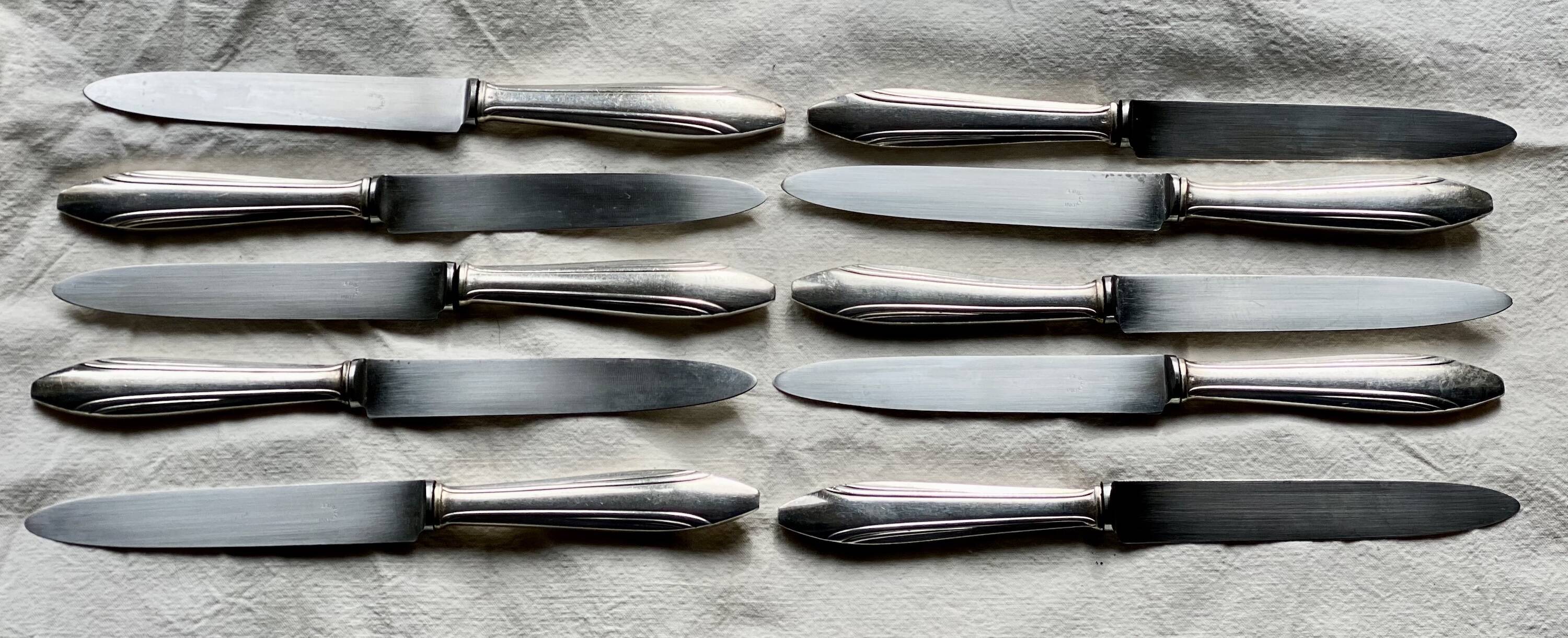 Set of 10 modernist silver-plated metal table knives.