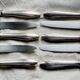 Set of 10 modernist silver-plated metal table knives.