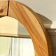 Round mirror in raw wood