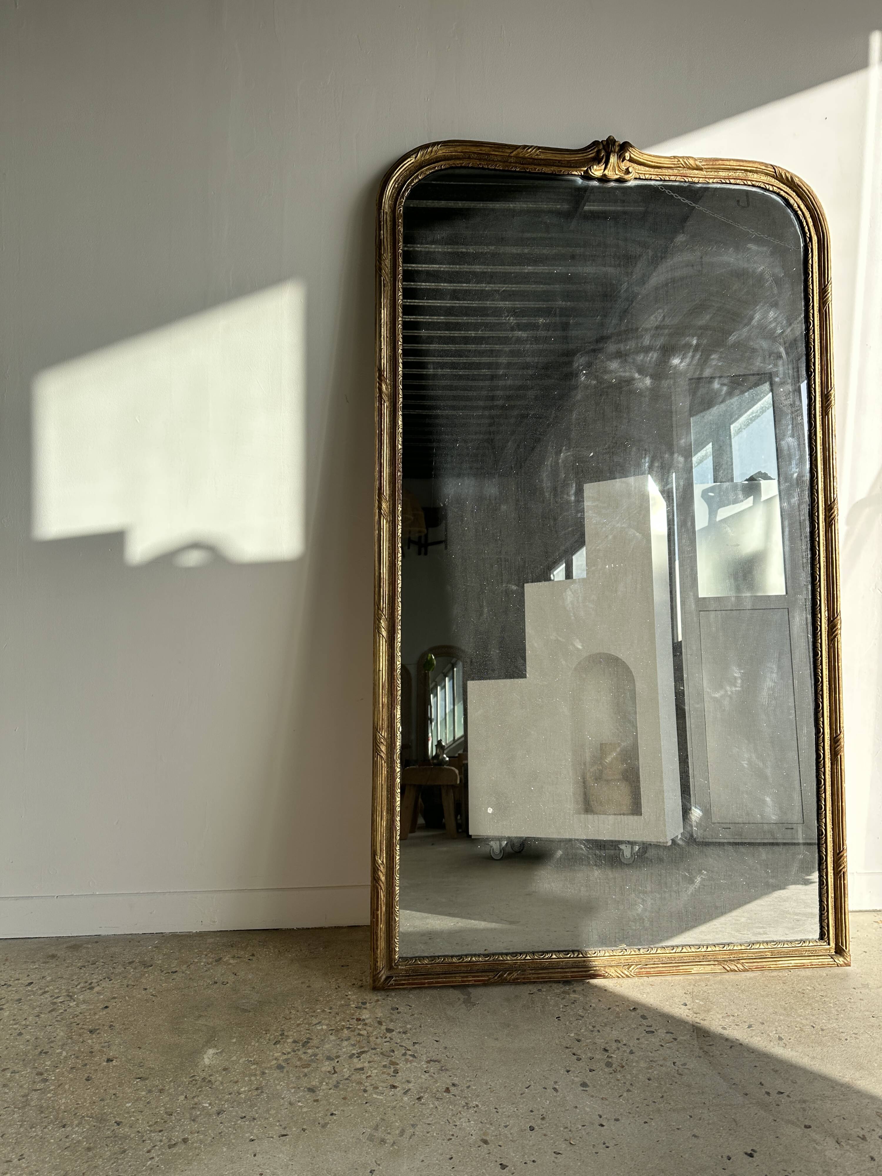 Large gilded mirror 19th century rounded corners mercury glass Louis XVI style