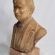 Bust of a notable in terracotta, 29 cm, signed Pasquet, 1870, on a base.