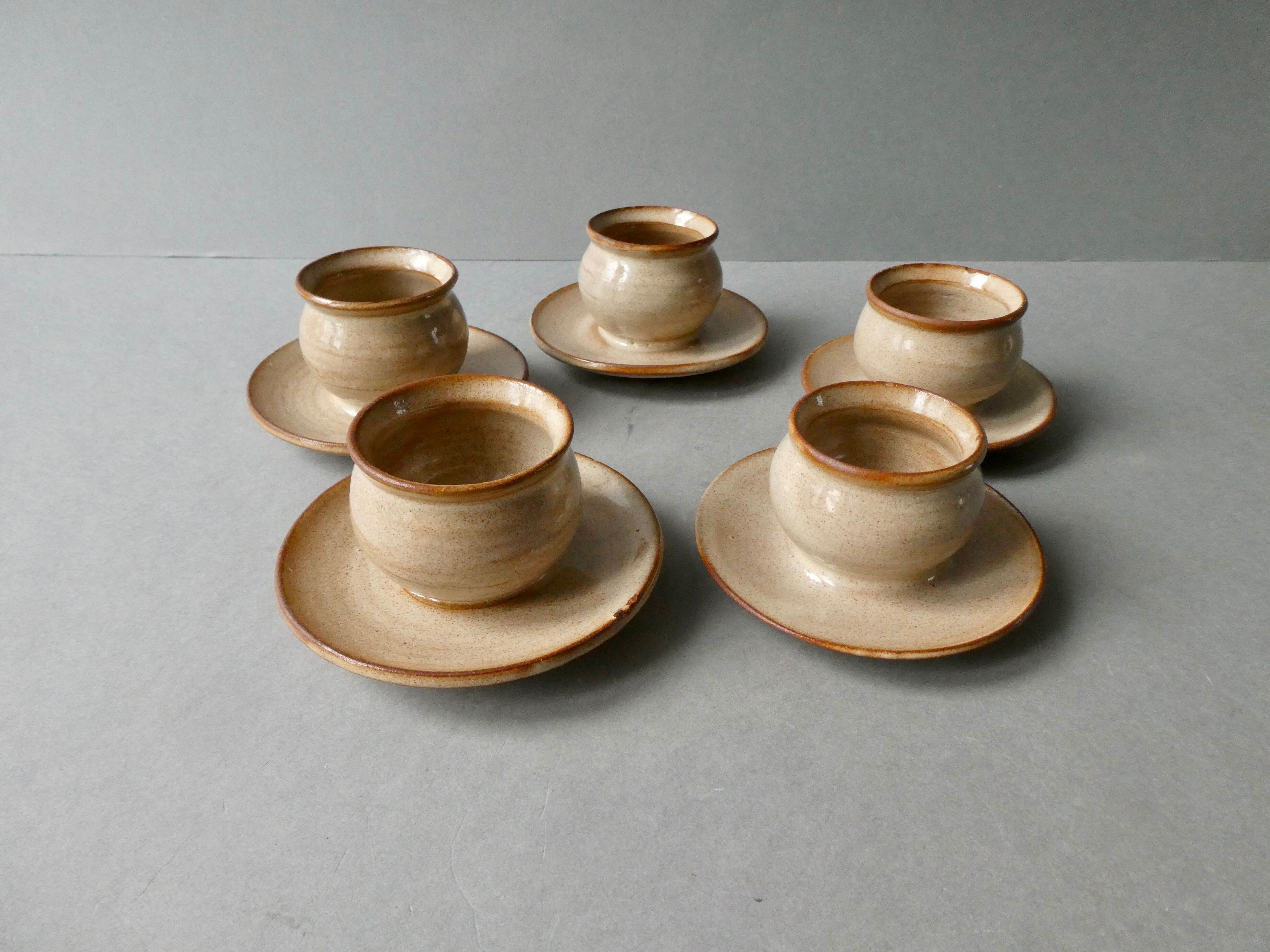 5 glazed stoneware shells, signed