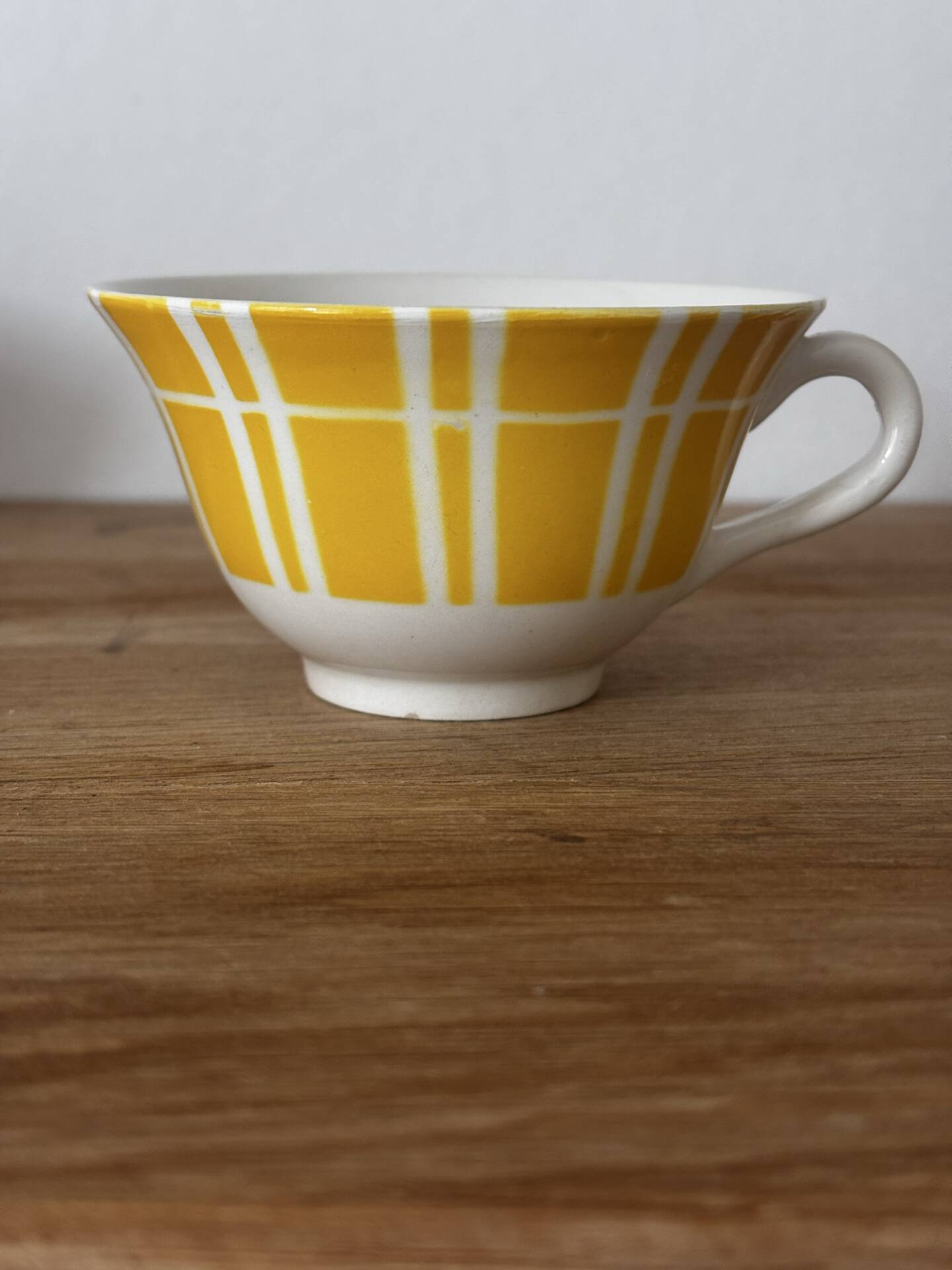 Set of two antique yellow Digoin Sarreguemines cups.
