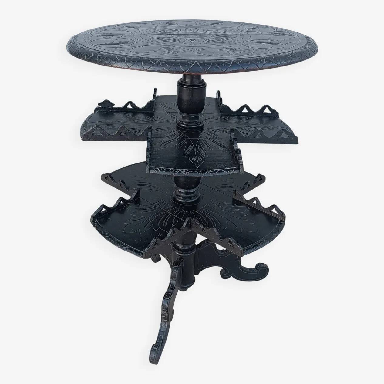 Napoleon III period gueridon in blackened wood.