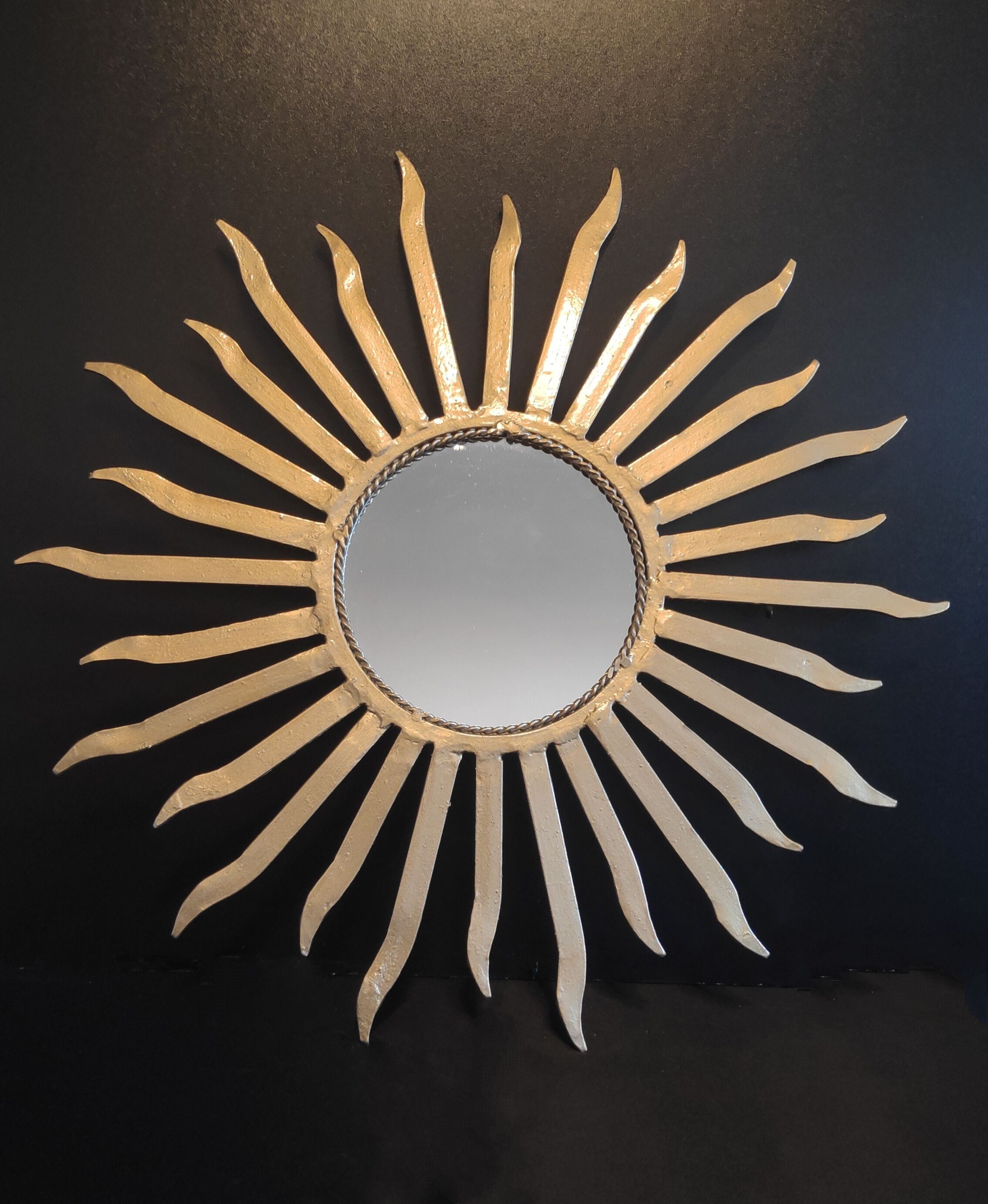 Miroir soleil en métal doré