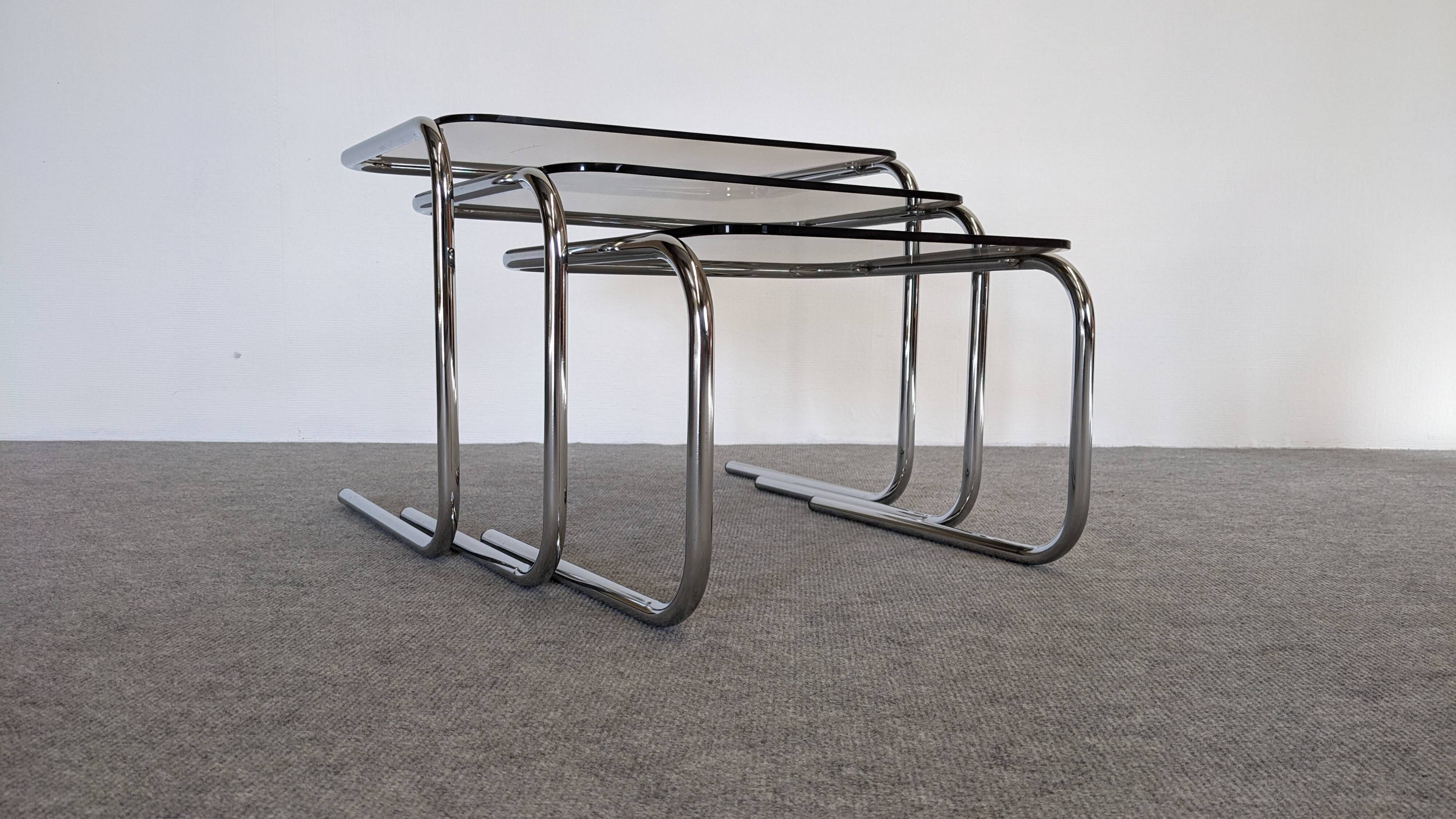 Nested tables with tubular chrome and smoked glass, France 1970.
