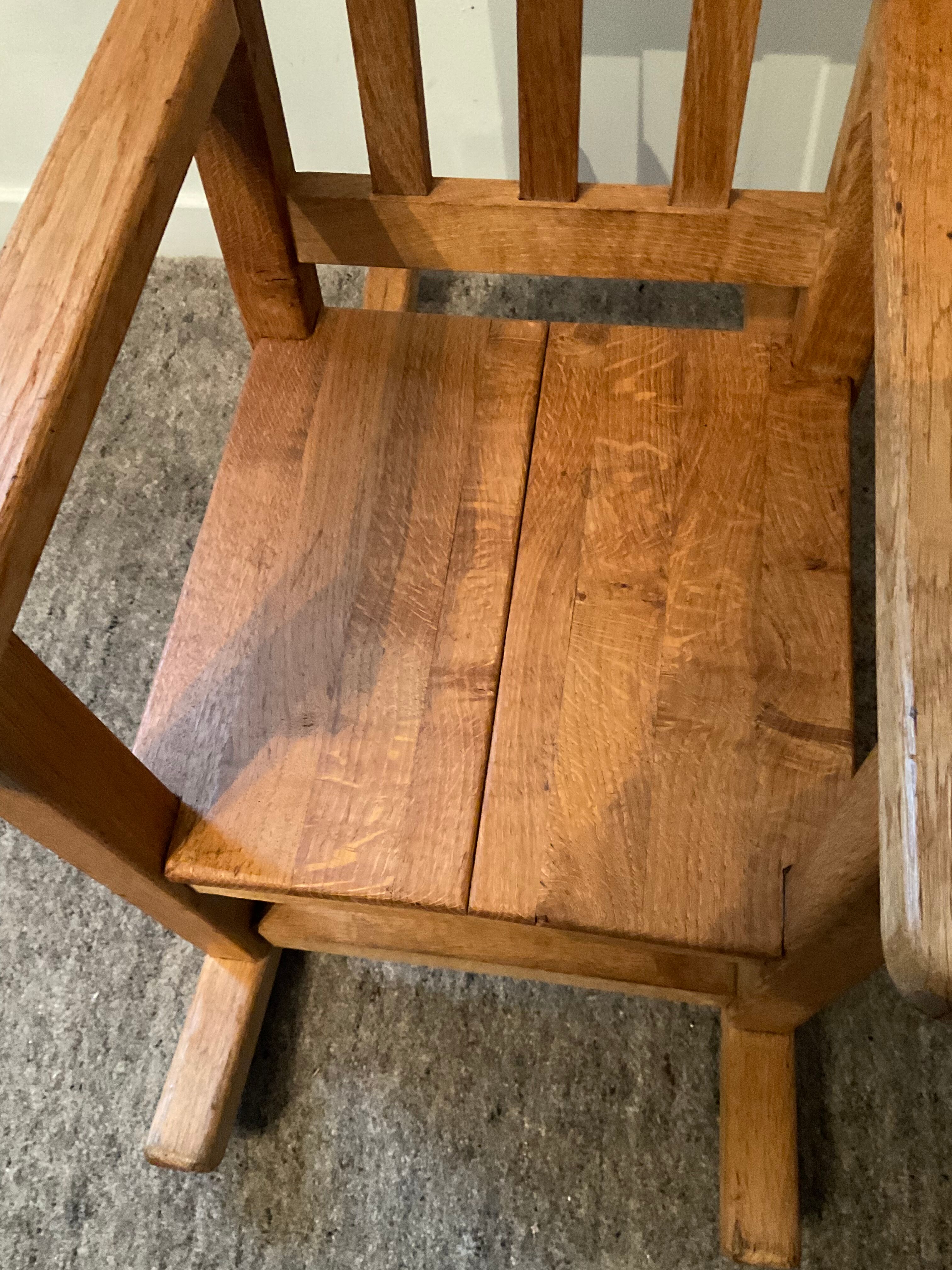 Old children's rocking chair in solid wood