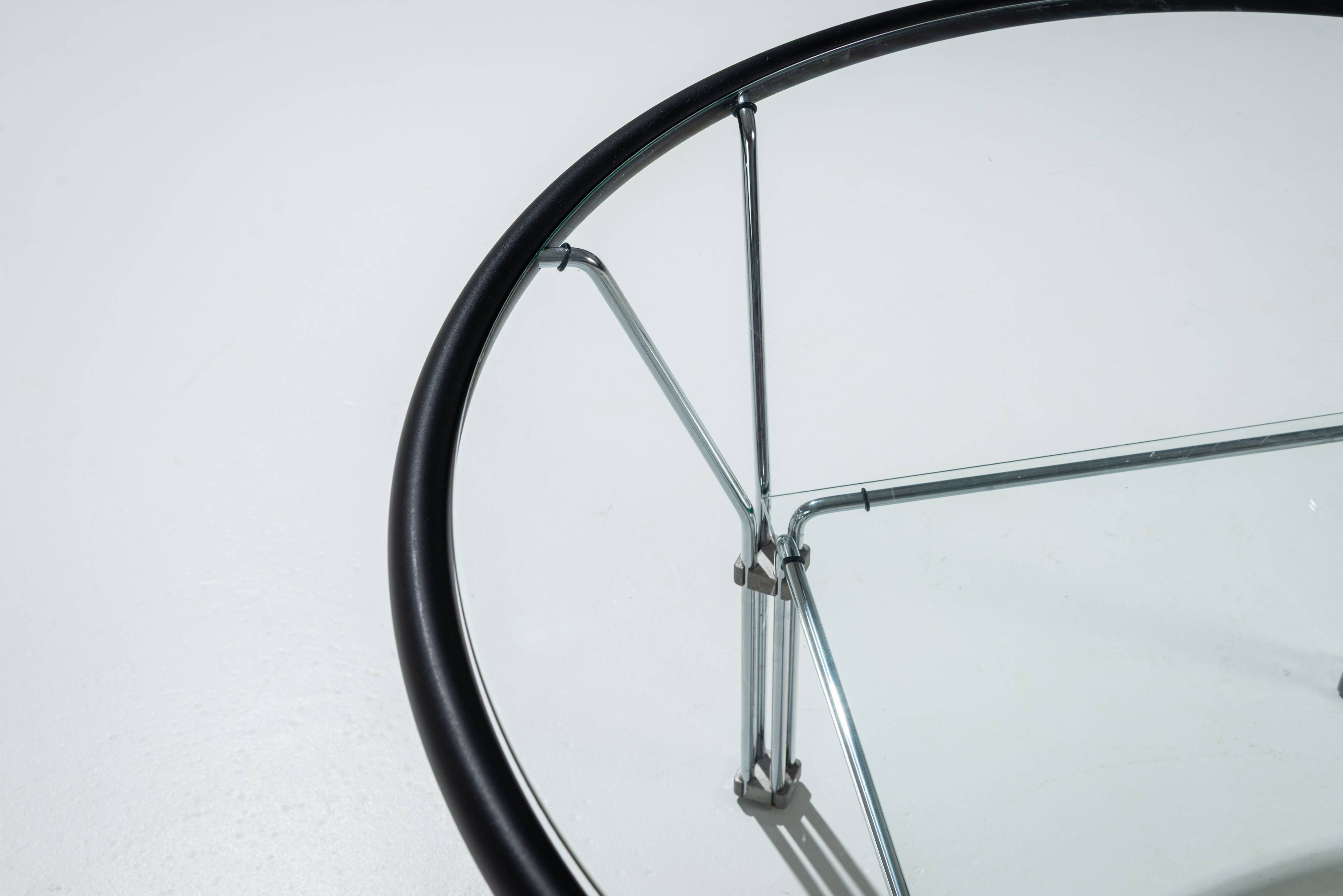 Post-Modern round glass and steel coffeetable attributed to Niels Bendtsen