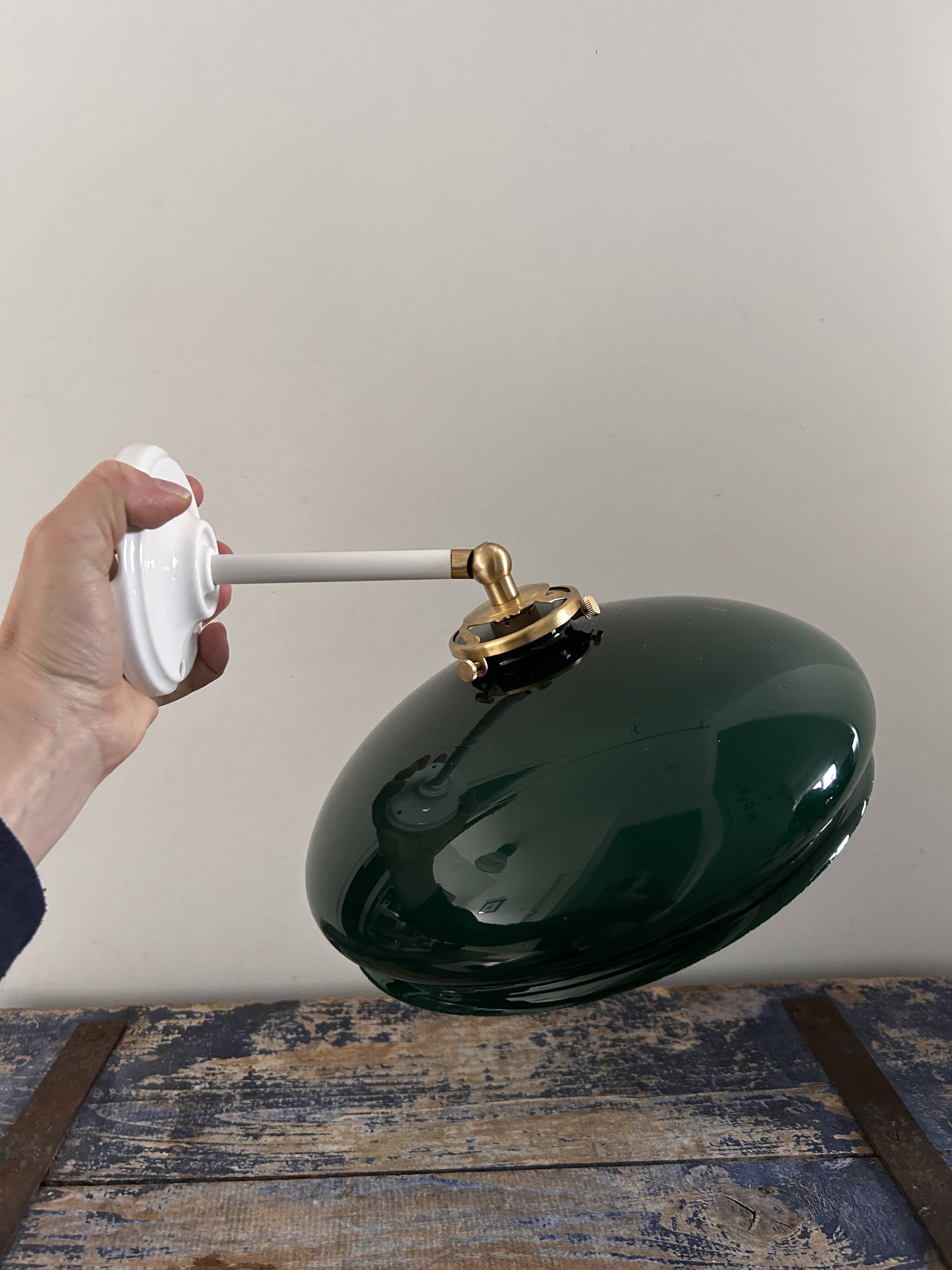 Tilting wall light in green opaline