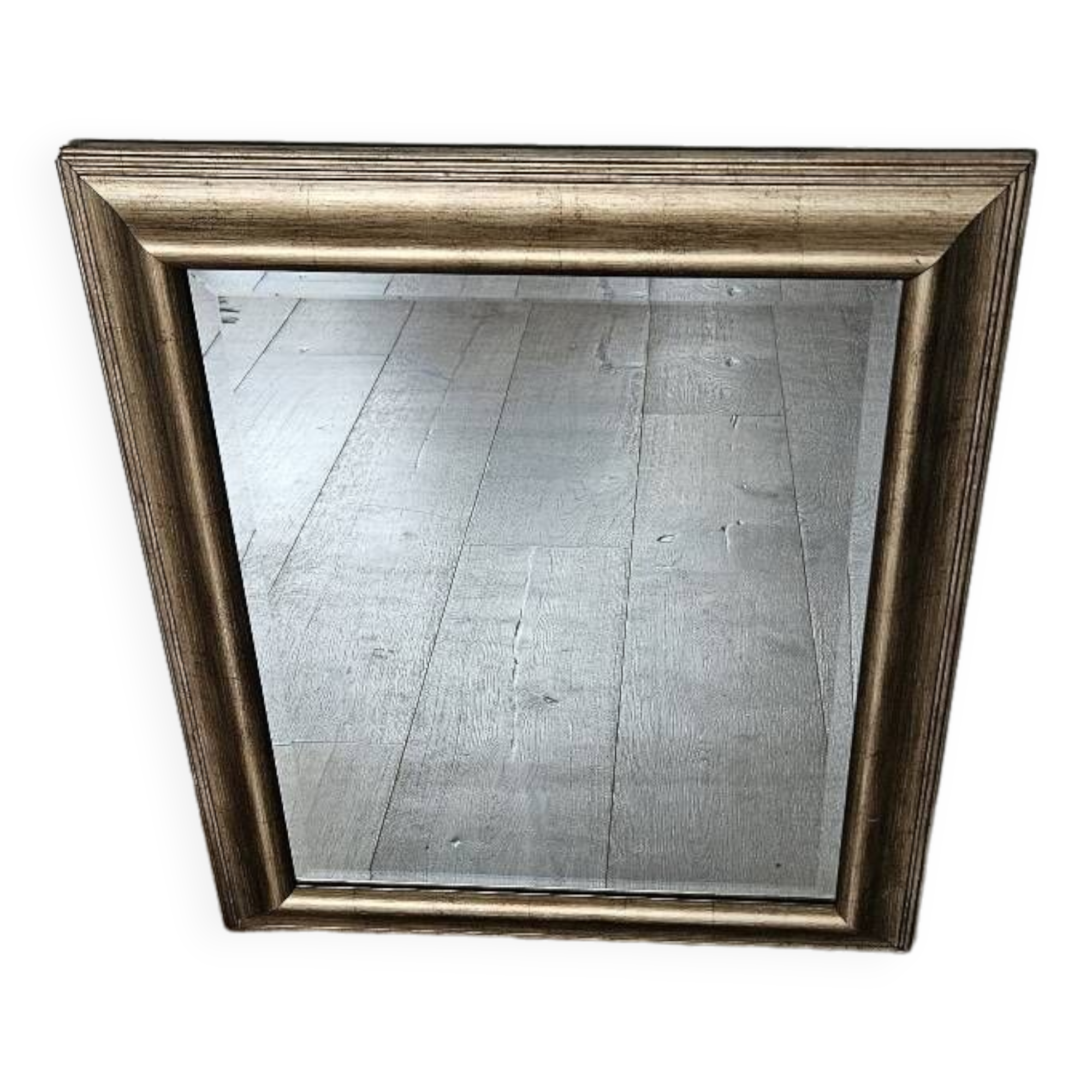 Beveled mirror under gold frame