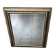 Beveled mirror under gold frame