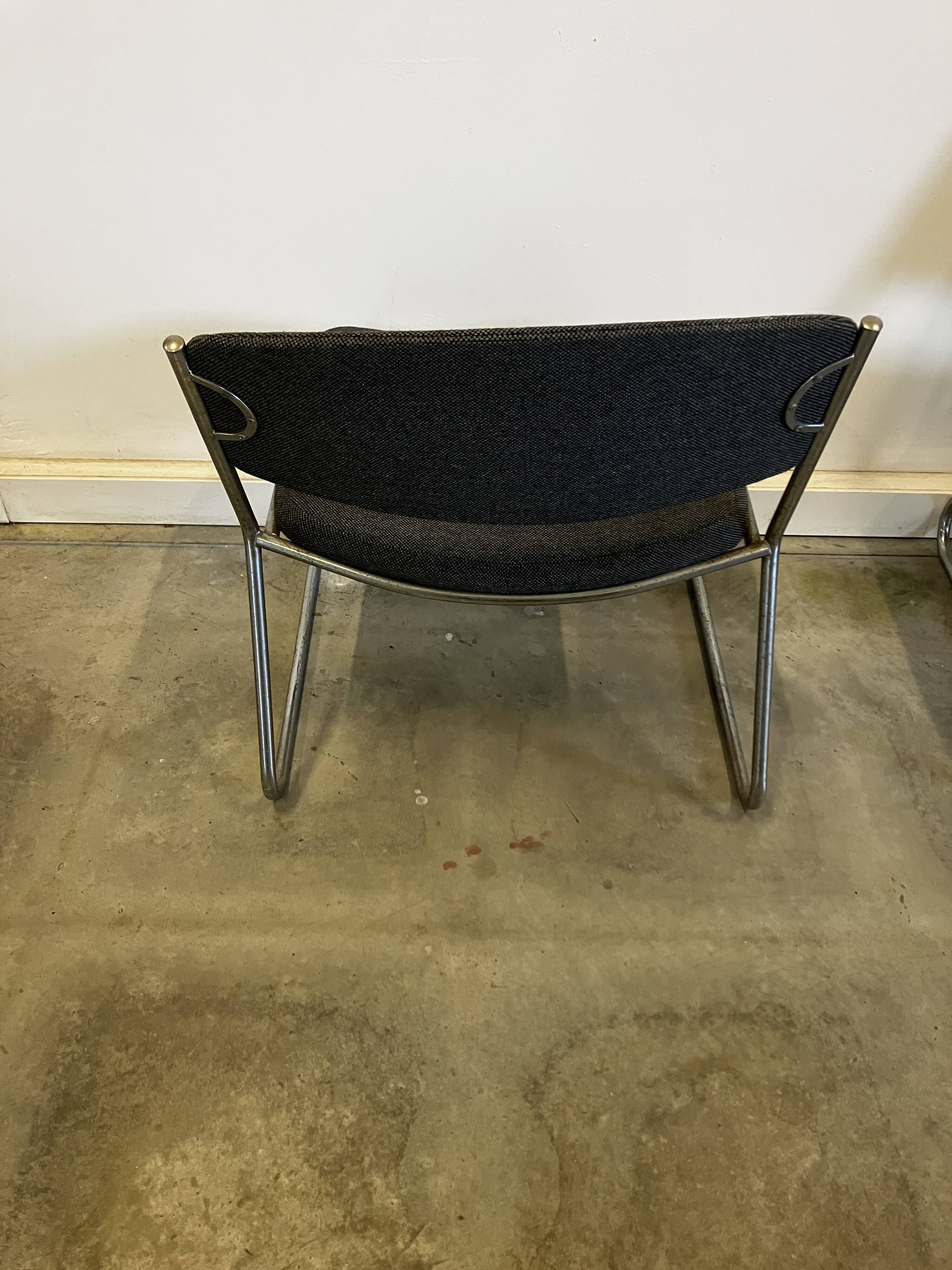 Pair of vintage armchairs in metal and grey mottled fabric.
