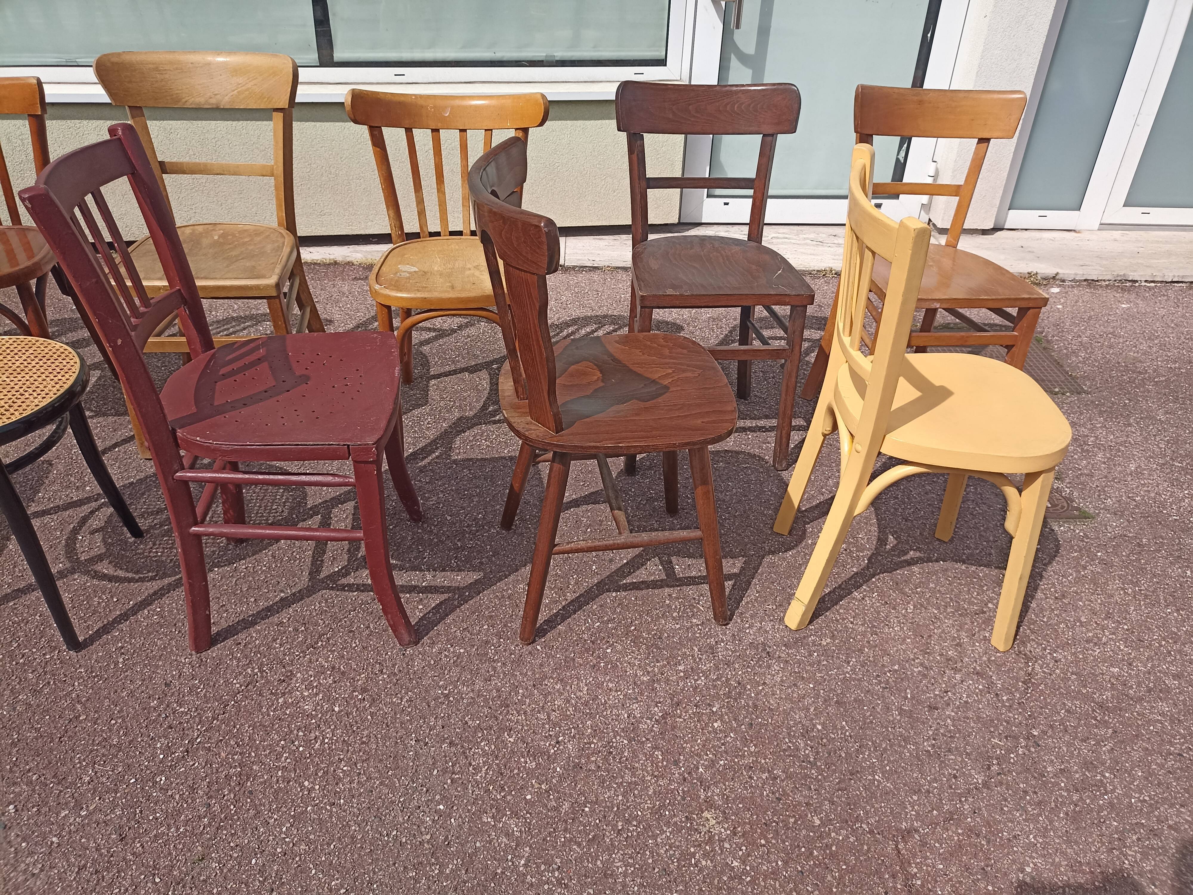 Set of 12 mismatched wooden bistro chairs