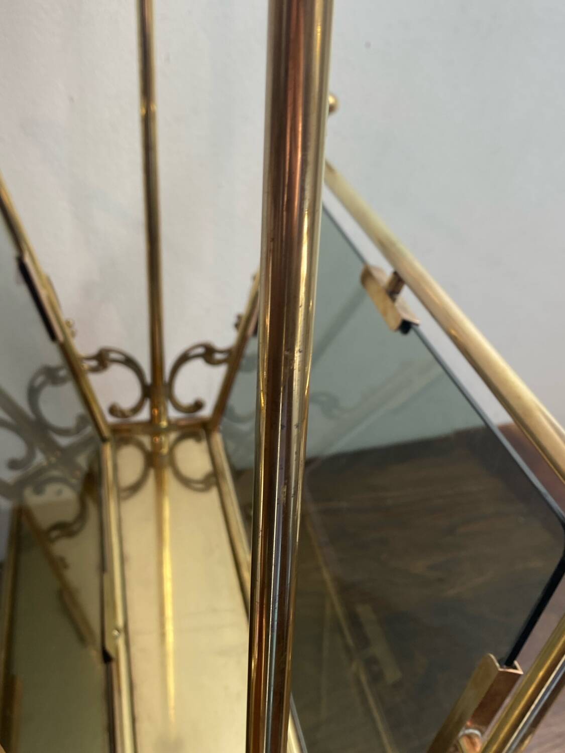 Brass magazine rack and blue-tinted glasses, 1950s.