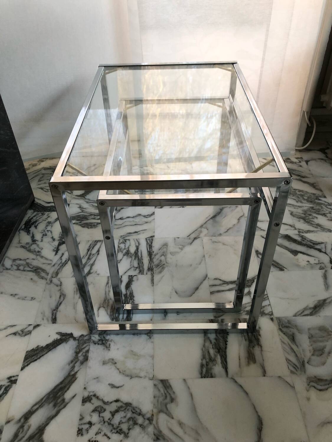 Nested tables in chrome metal and glass, Italy circa 1970.