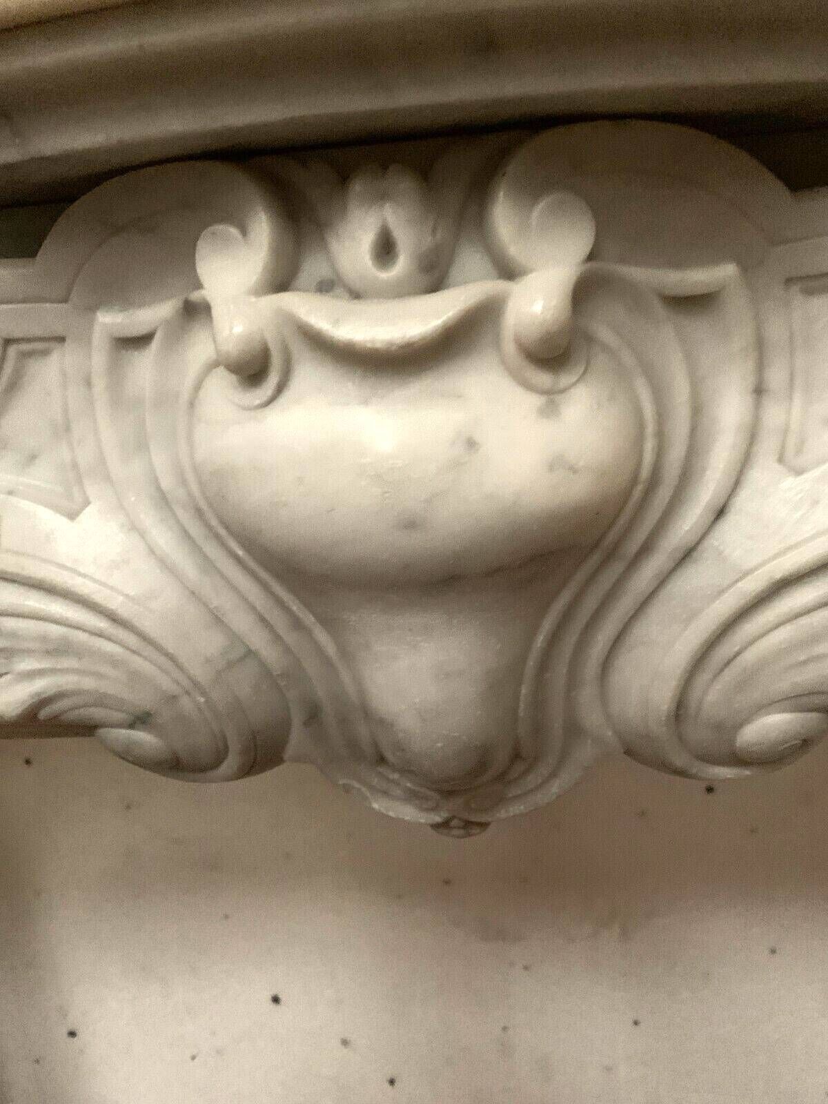 Regency style fireplace in white Carrara marble, Italy, 19th century.